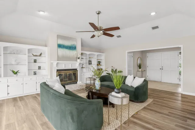 a living room with furniture and a fireplace