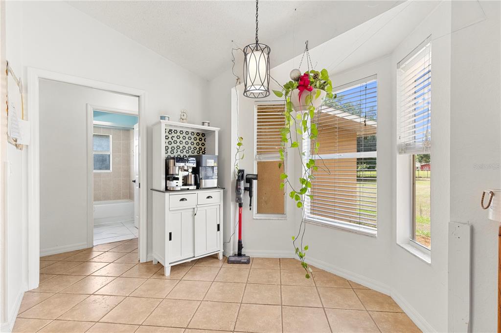 9917 Nelson Road Dade City, FL 33525 - Photo 18 of 40 a view of kitchen with furniture and window