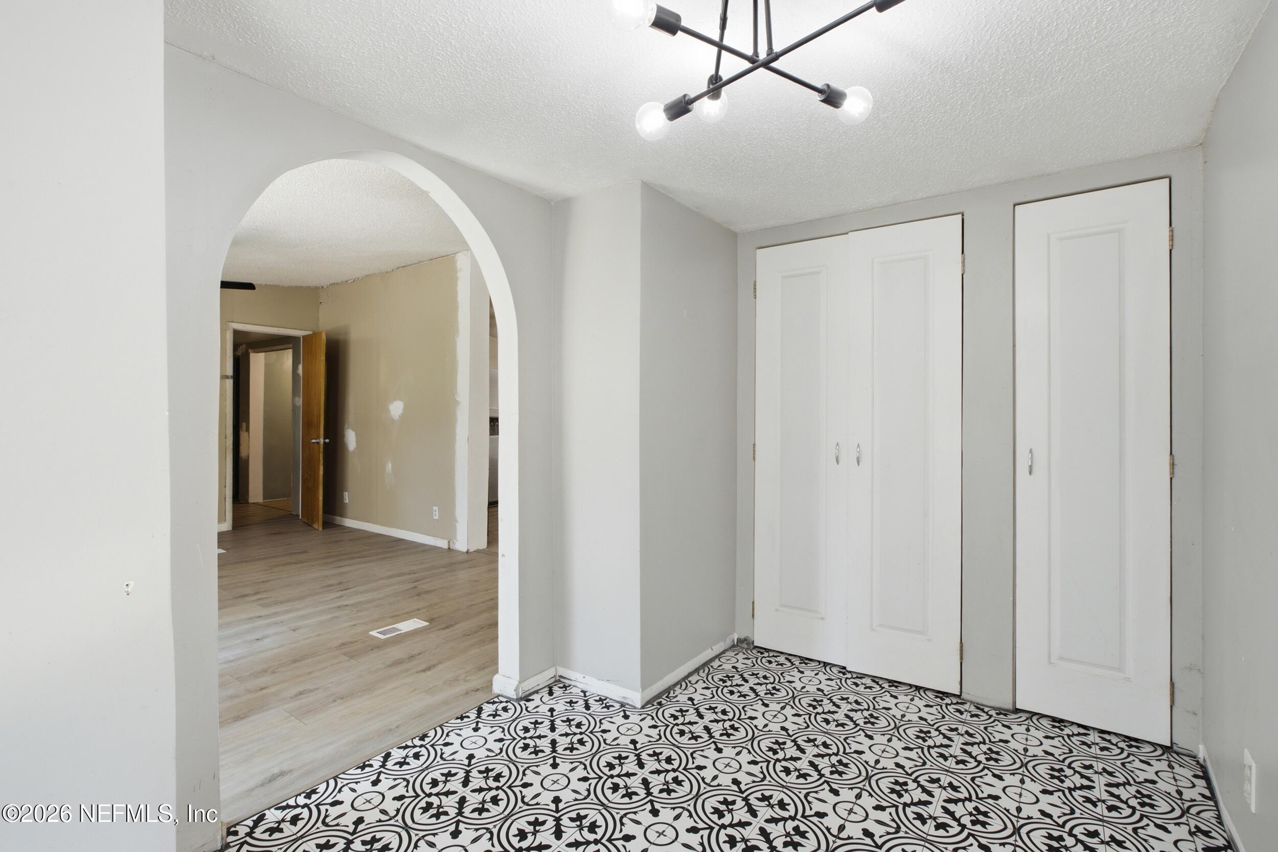 5667 Long Branch Cemetery Road Jacksonville, FL 32234 - Photo 8 of 24 a view of a hallway with a bathroom