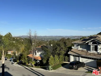a view of a city street from a balcony