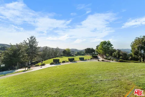 a view of a lake with houses in the background