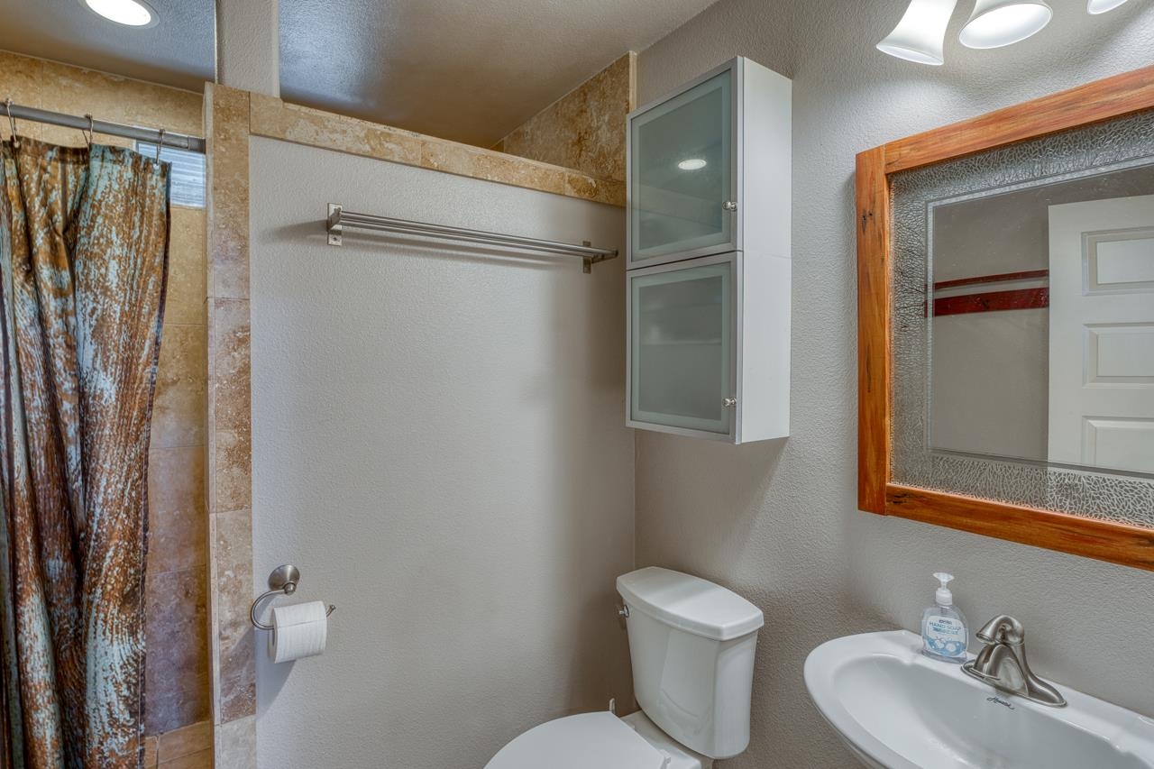 352 Keller Velino Road Mason, TX 76856 - Photo 12 of 25 a bathroom with a toilet sink and shower