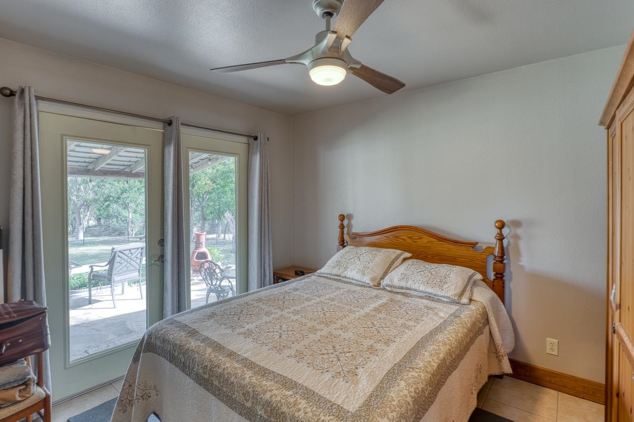 352 Keller Velino Road Mason, TX 76856 - Photo 13 of 25 a bedroom with a large bed and a window