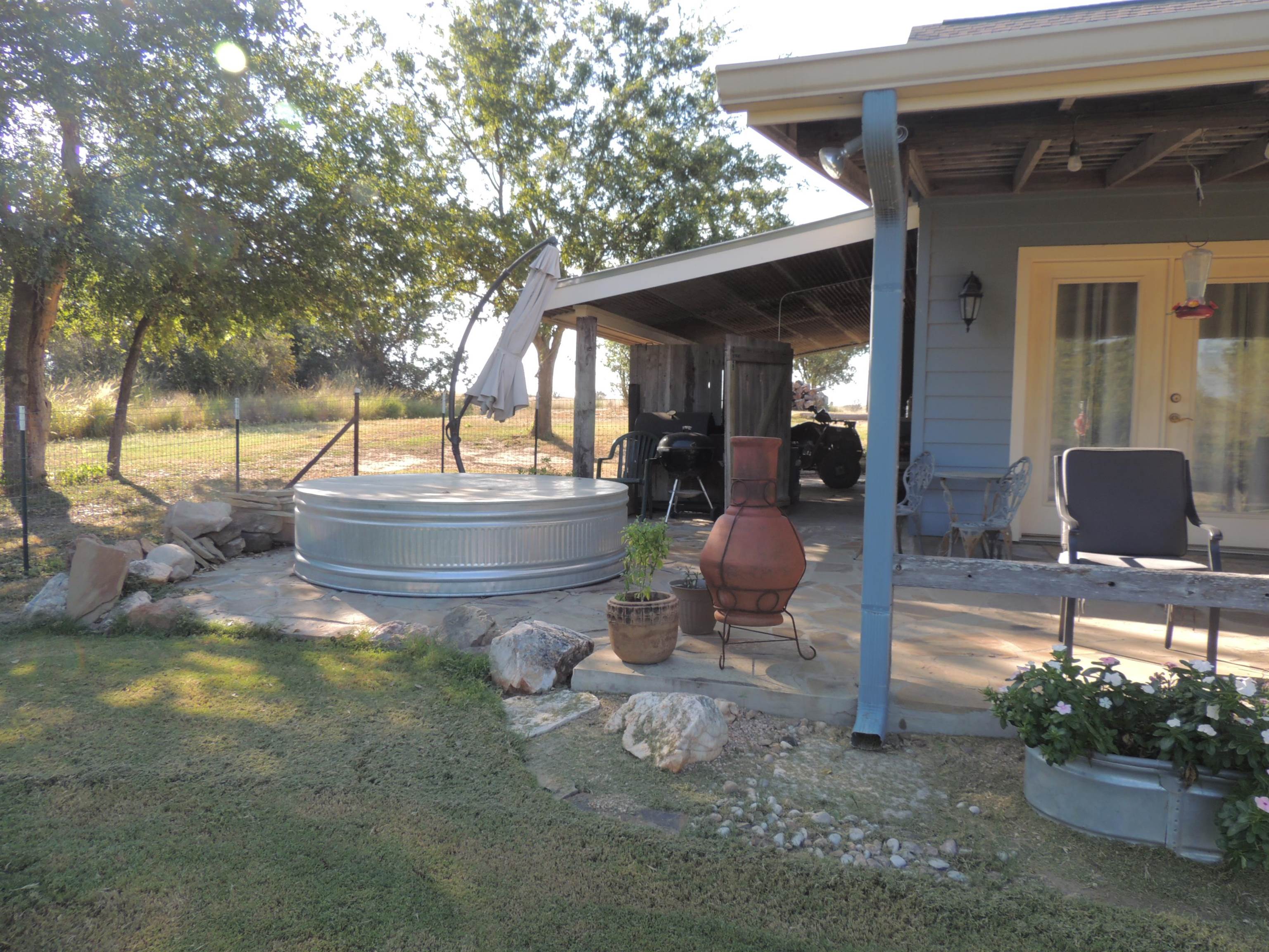 352 Keller Velino Road Mason, TX 76856 - Photo 22 of 25 a backyard of a house with yard and outdoor seating