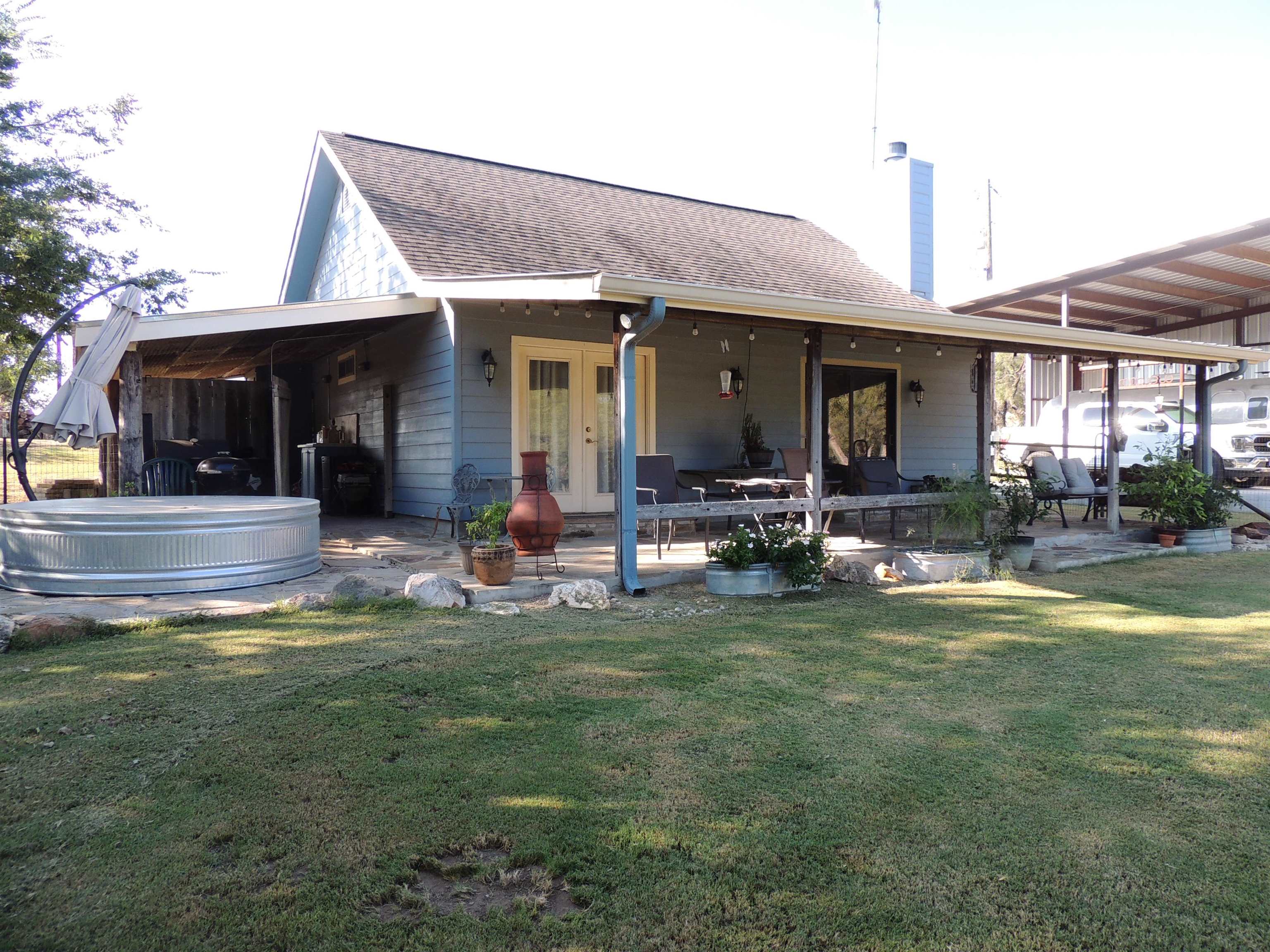 352 Keller Velino Road Mason, TX 76856 - Photo 25 of 25 a view of a house with swimming pool and a yard