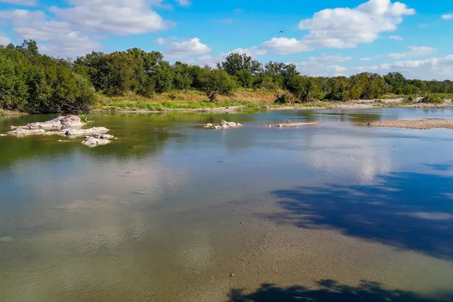 a kitchen with sink cabinets and window