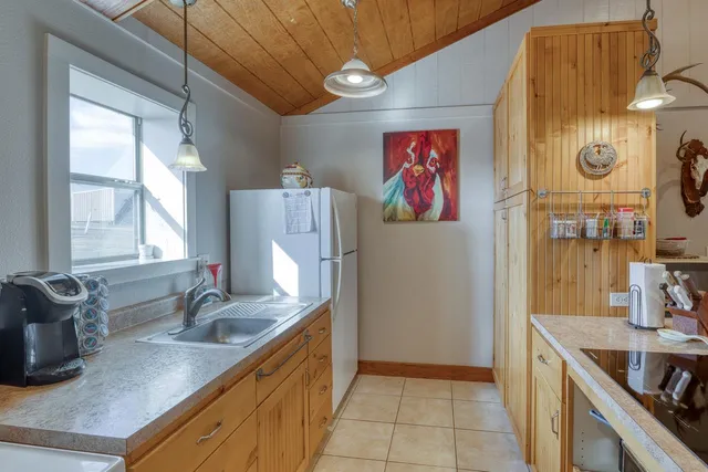 a kitchen that has a cabinets and a table in it