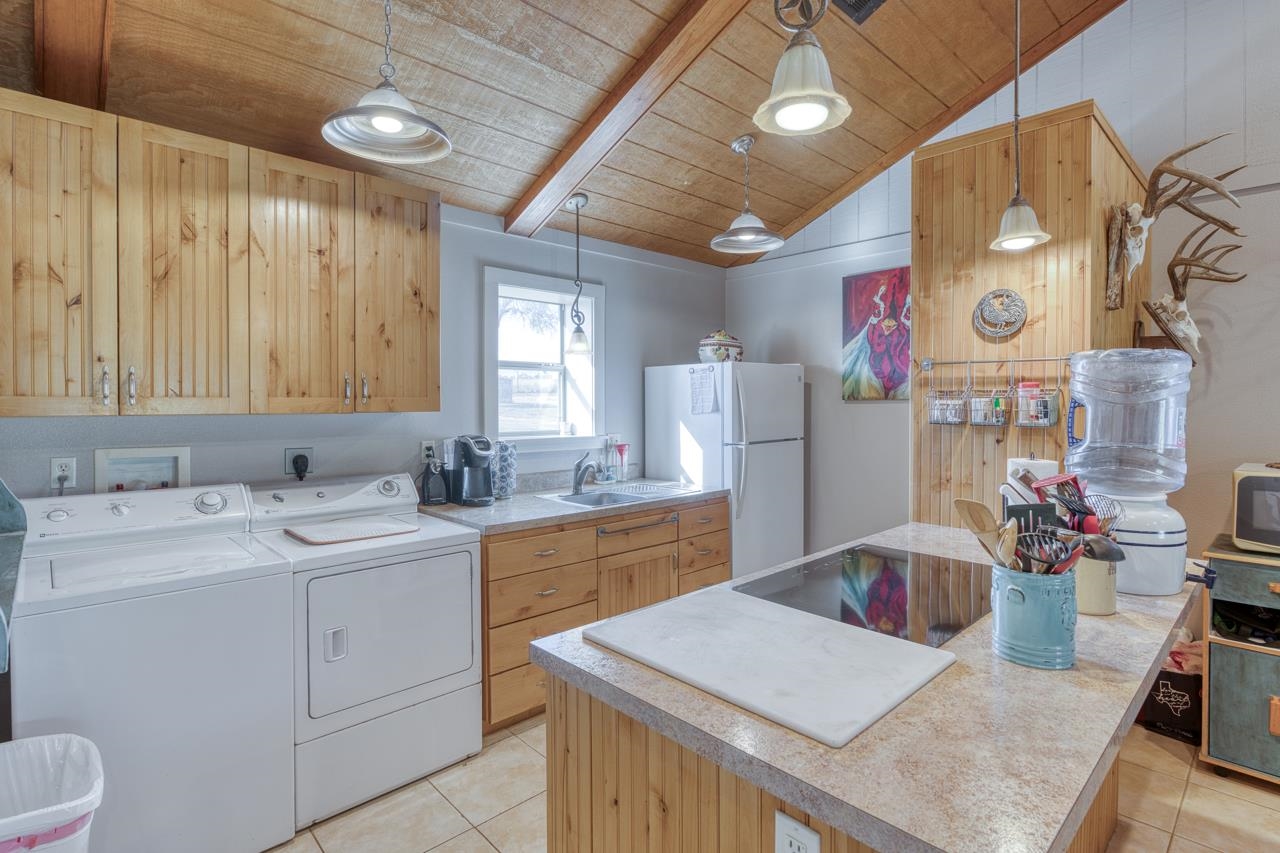 352 Keller Velino Road Mason, TX 76856 - Photo 9 of 25 a kitchen that has a cabinets and a table in it