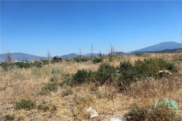 a view of a town with mountains in the background
