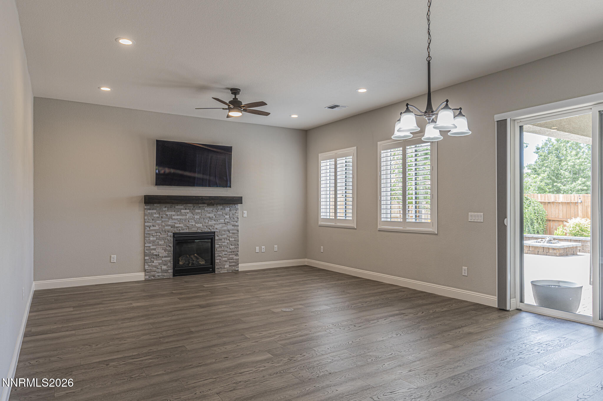 2109 Cast Iron Drive Reno, NV 89521 - Photo 3 of 35 a view of an empty room with wooden floor and a window