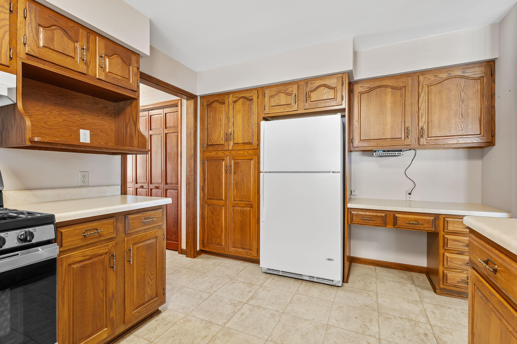 1905 Juniper Street Southwest De Motte, IN 46310 - Photo 12 of 42 a kitchen with stainless steel appliances granite countertop a refrigerator and a sink