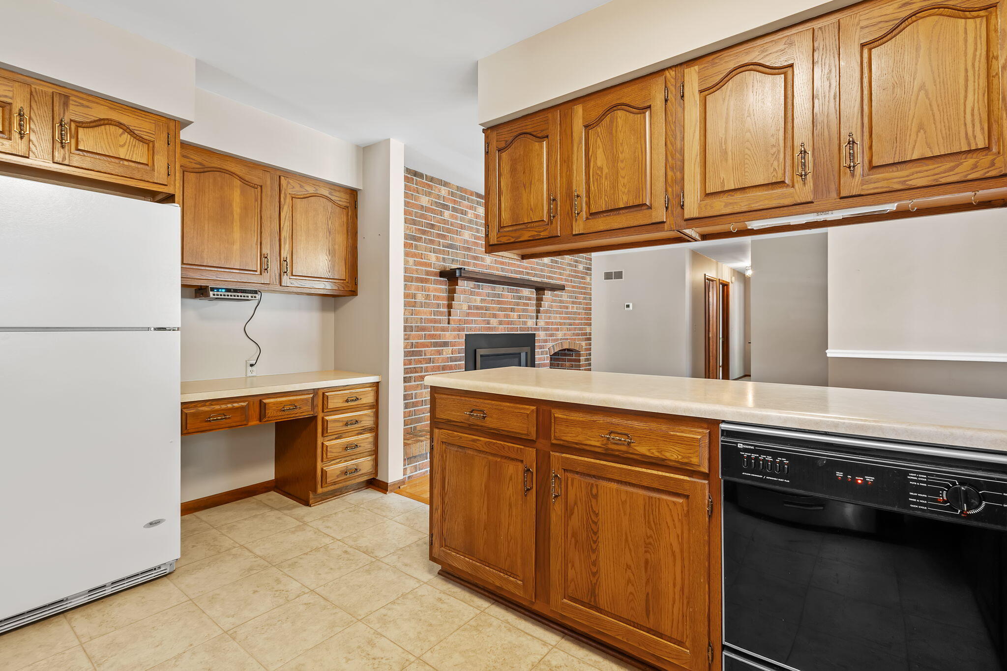 1905 Juniper Street Southwest De Motte, IN 46310 - Photo 13 of 42 a kitchen with stainless steel appliances granite countertop a refrigerator and a stove top oven