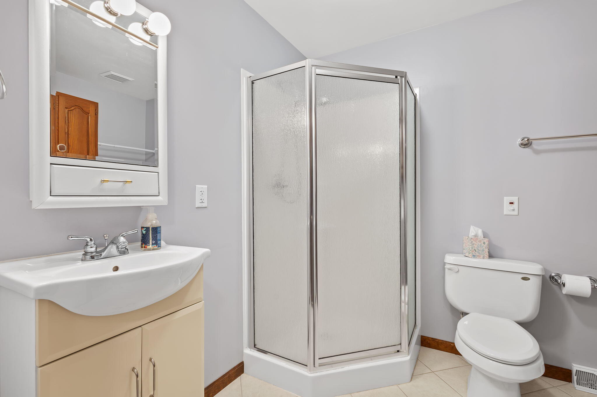 1905 Juniper Street Southwest De Motte, IN 46310 - Photo 29 of 42 a bathroom with a sink a toilet and shower