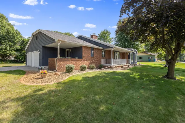 a front view of house with yard and outdoor seating