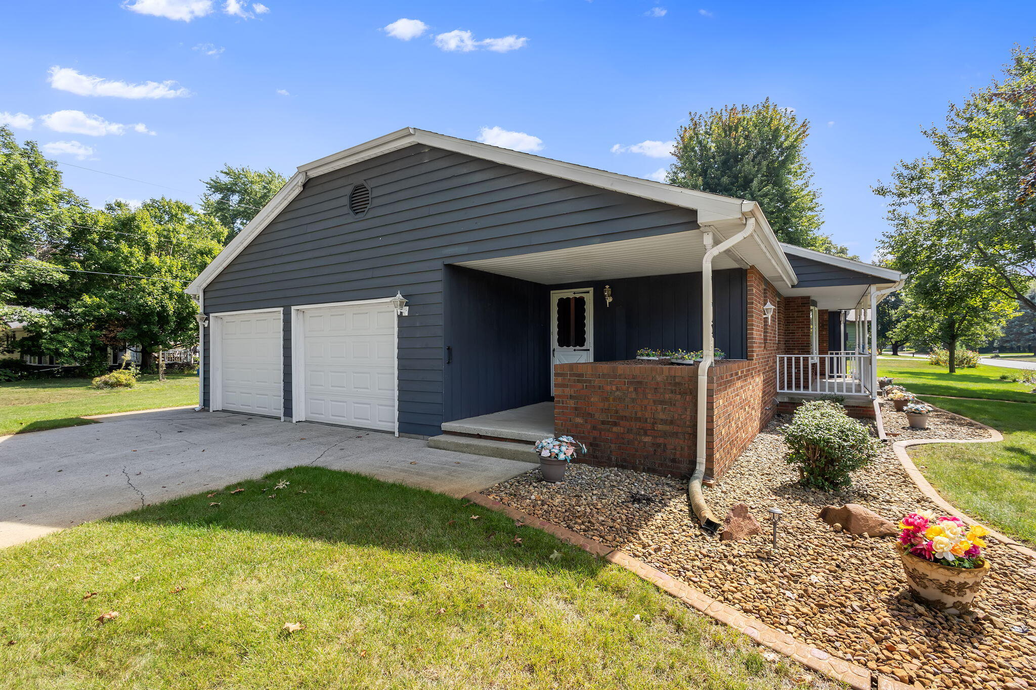 1905 Juniper Street Southwest De Motte, IN 46310 - Photo 4 of 42 a view of a house with backyard and trees