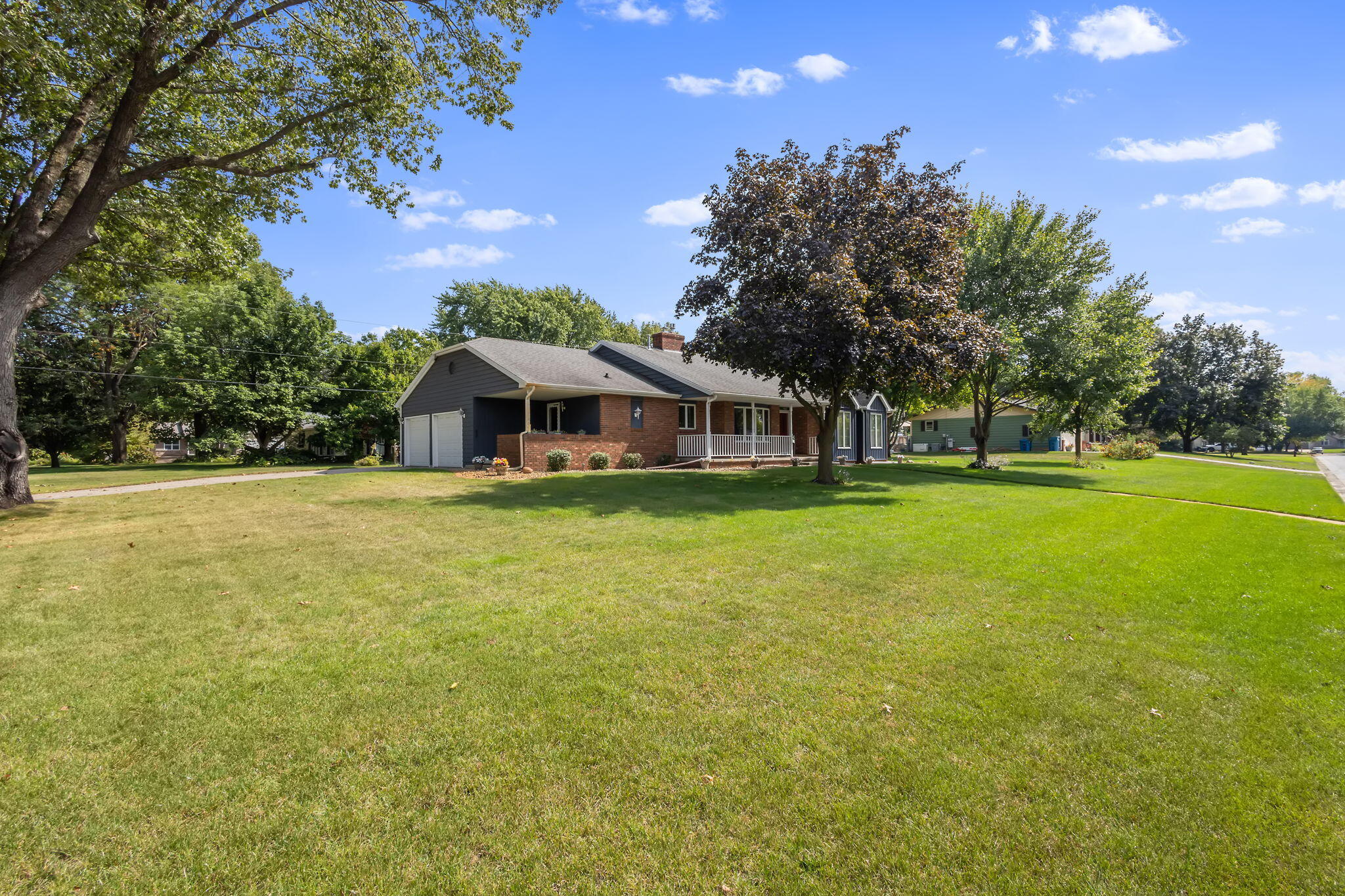 1905 Juniper Street Southwest De Motte, IN 46310 - Photo 41 of 42 a front view of house with yard and outdoor seating