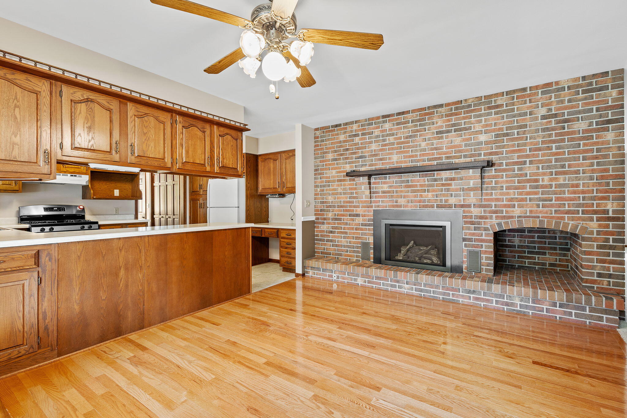 1905 Juniper Street Southwest De Motte, IN 46310 - Photo 8 of 42 a view of kitchen with furniture and fireplace