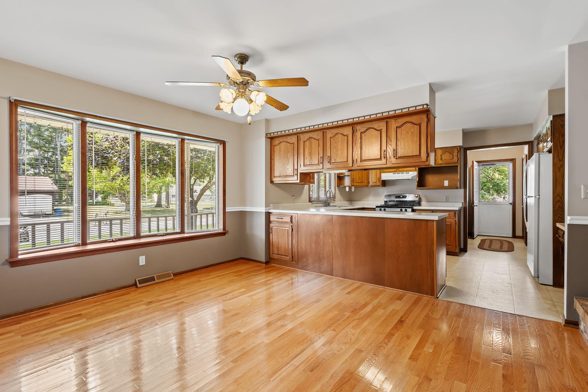 1905 Juniper Street Southwest De Motte, IN 46310 - Photo 9 of 42 a view of kitchen with wooden floor and electronic appliances