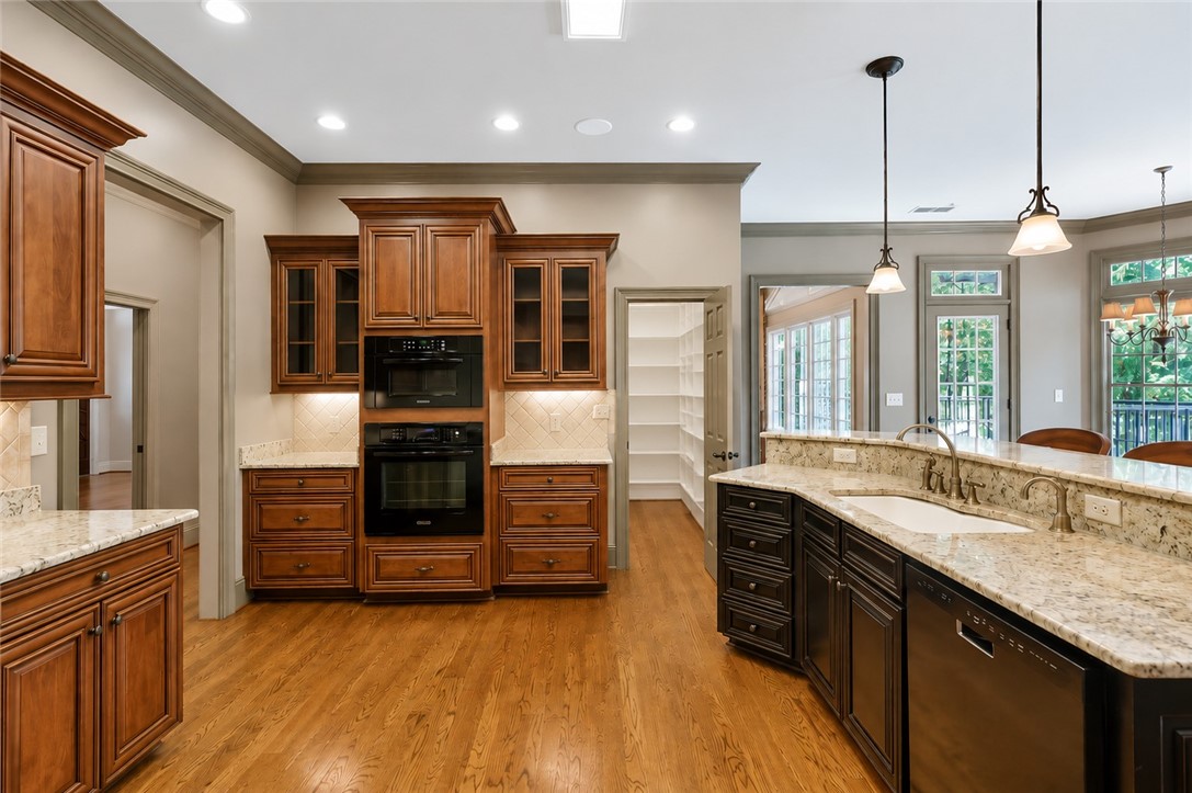 114 Willowbend Drive Anderson, SC 29621 - Photo 19 of 50 This spacious kitchen offers ample storage, modern appliances, and convenient access to outdoor living.
