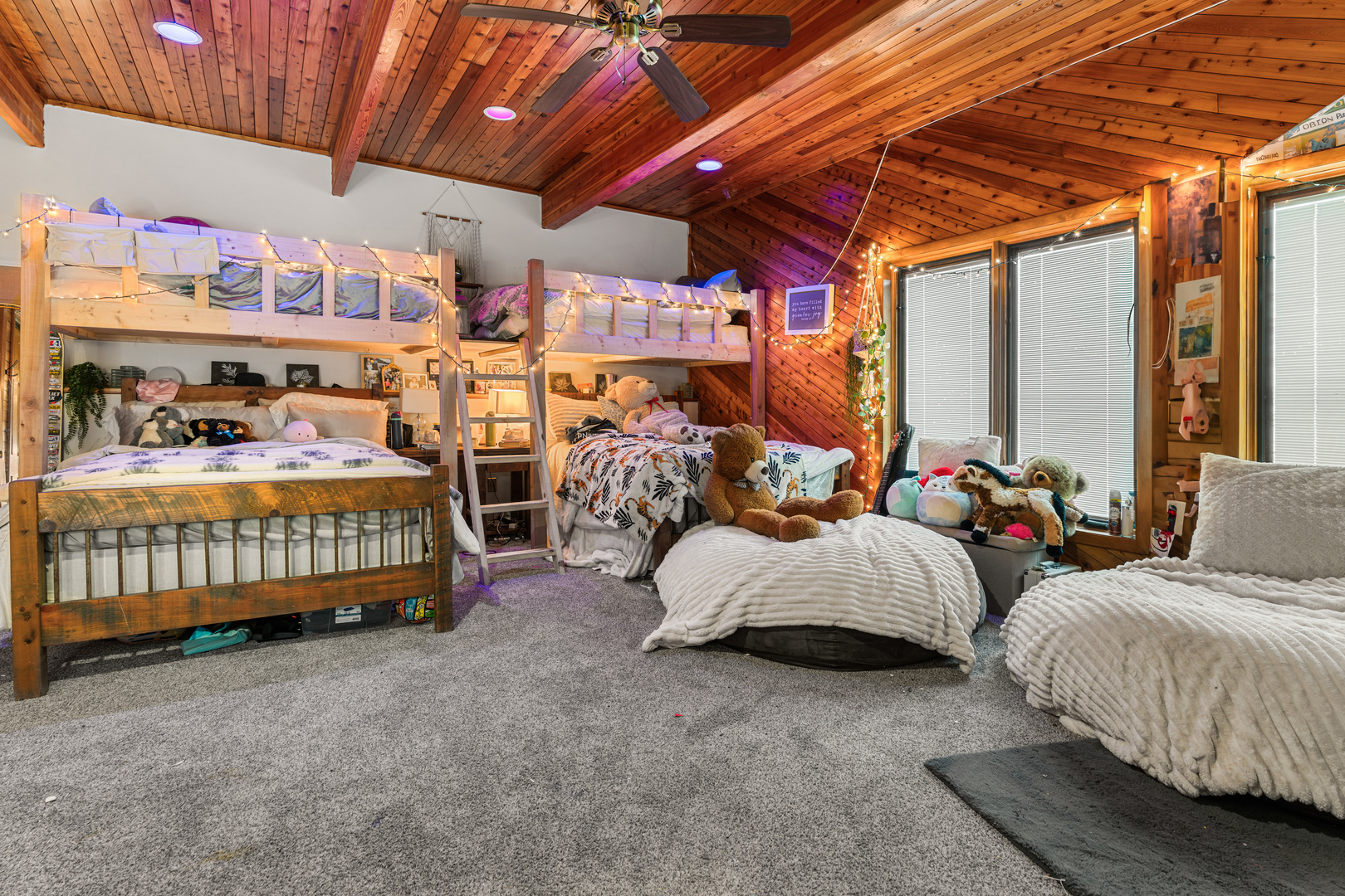 12300 River Road Plano, IL 60545 - Photo 16 of 25 a bedroom with two beds and a chandelier