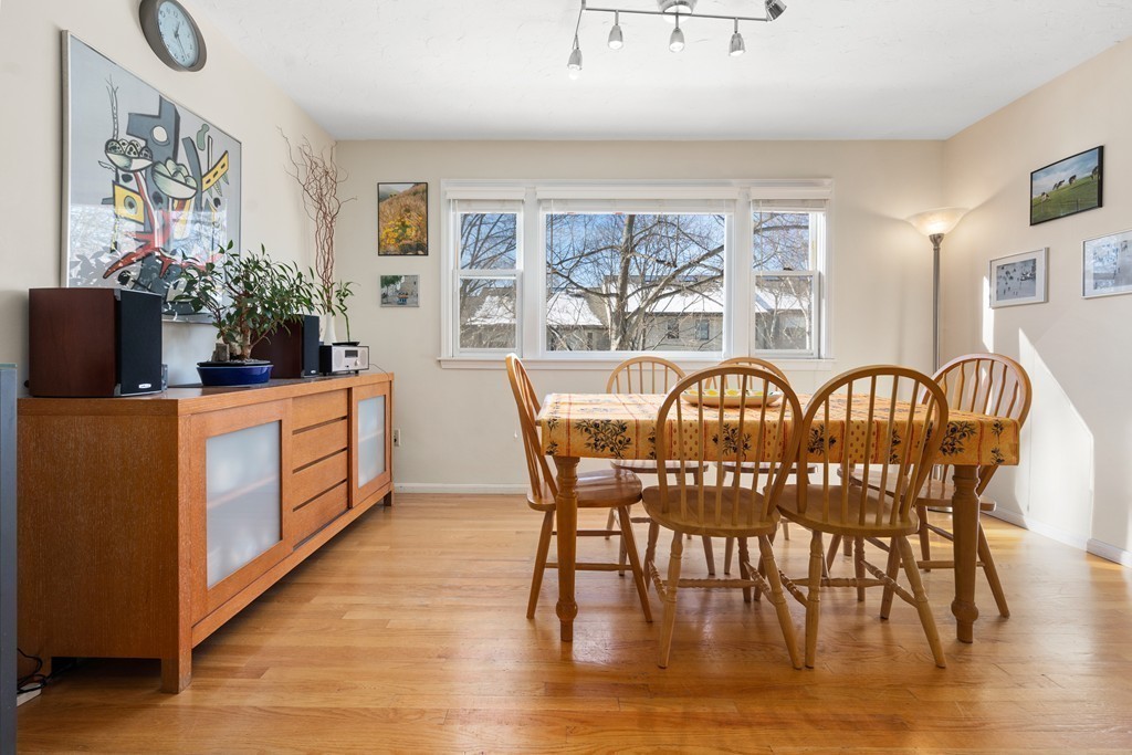 48 Regent Circle, Unit 48 Brookline, MA 02445 - Photo 4 of 14 a view of a dining room with furniture and wooden floor