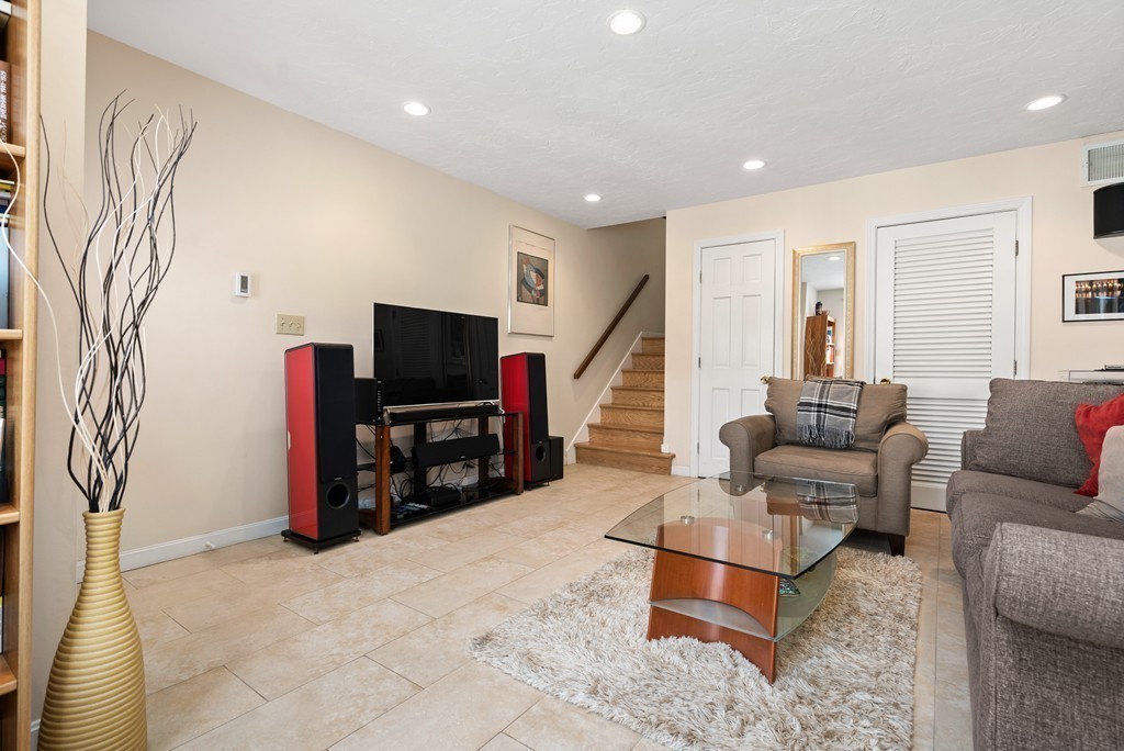 48 Regent Circle, Unit 48 Brookline, MA 02445 - Photo 6 of 14 a living room with furniture and a flat screen tv