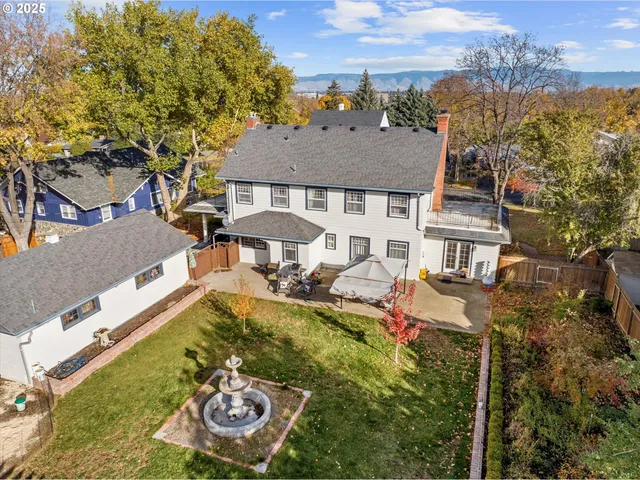 aerial view of a house with swimming pool and porch