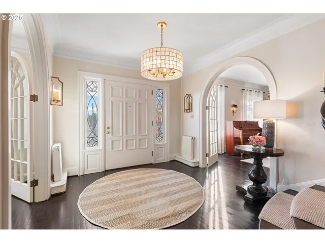 a view of a livingroom with furniture and entryway