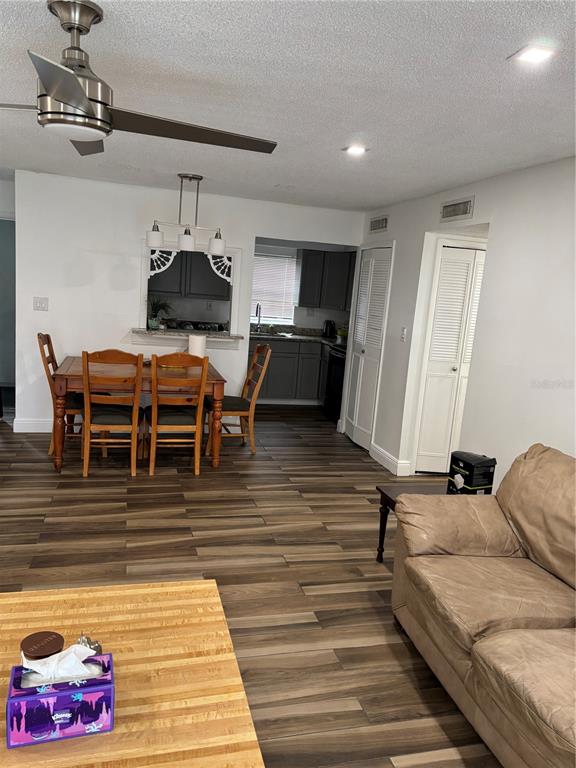 3057 Aaron Burr Avenue, Unit 1 Winter Park, FL 32792 - Photo 7 of 11 a dining room with furniture and wooden floor