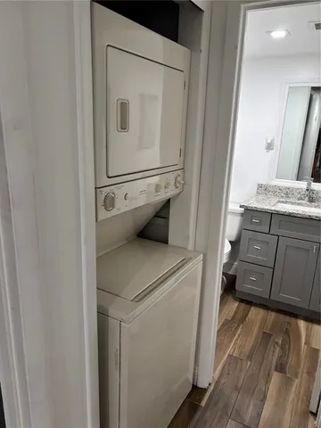 a kitchen with a refrigerator and a sink