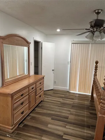 a spacious bathroom with a vanity and a mirror