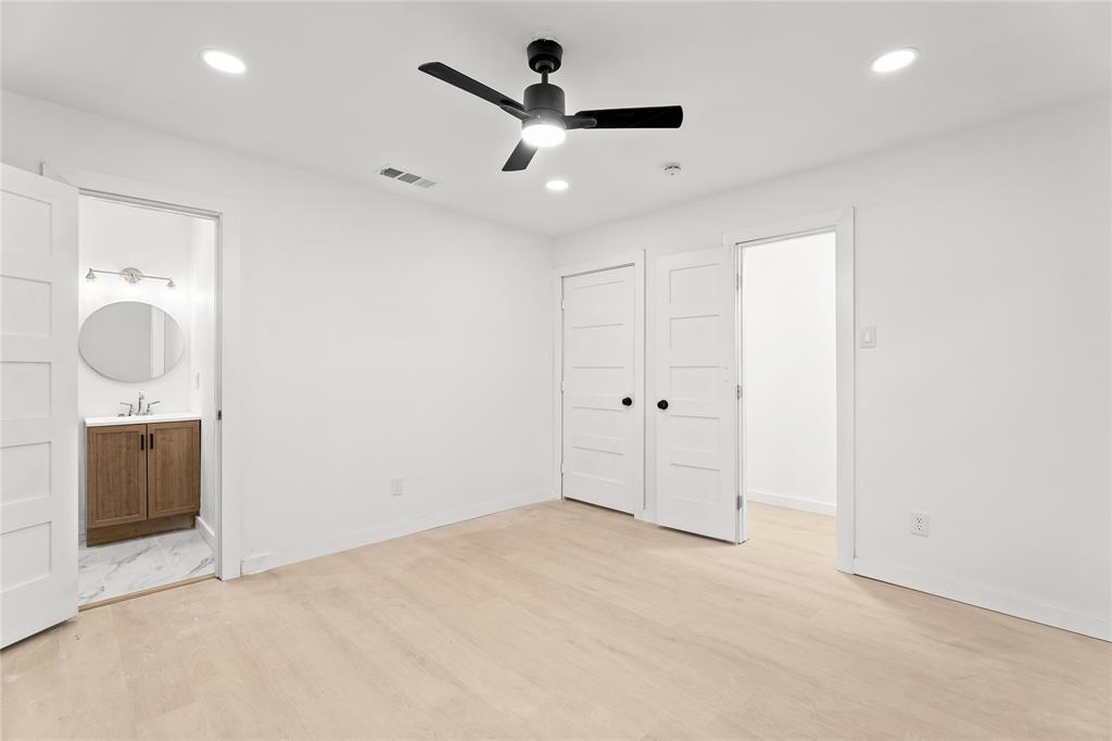 110 Hackberry Street Lancaster, TX 75146 - Photo 15 of 32 Light wood-finish flooring complements white walls and recessed ceiling lighting
