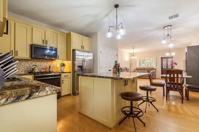 a view of a kitchen counter space and wooden floor