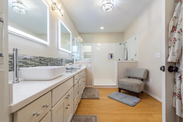 a bathroom with a shower and a sink