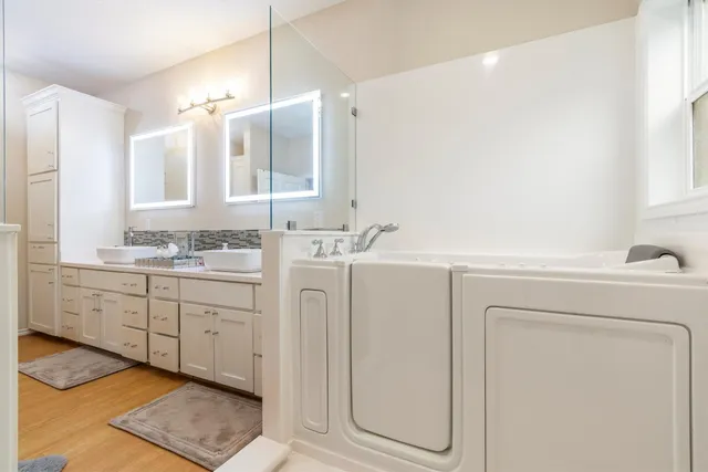 a bedroom with a bed a desk and chair