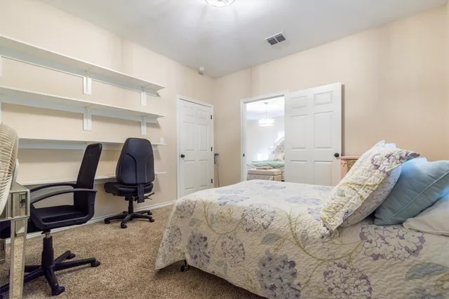 a spacious bathroom with 2 sink tub and a mirror