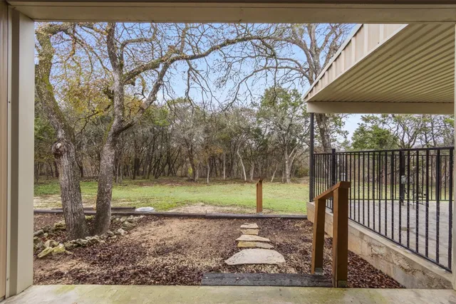 a backyard of a house with lots of green space