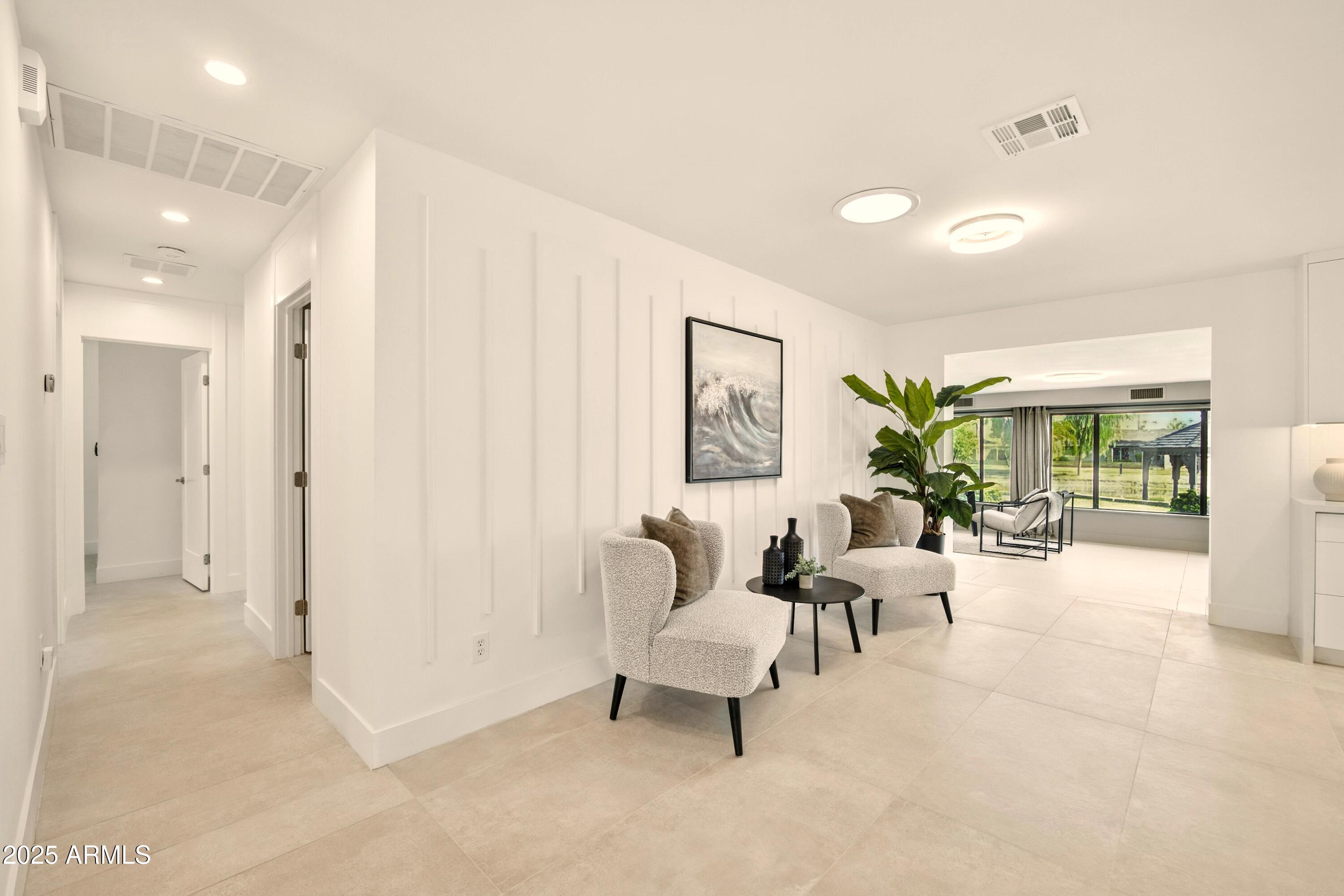 2425 West Impala Circle Mesa, AZ 85202 - Photo 12 of 55 a living room with furniture and a large window