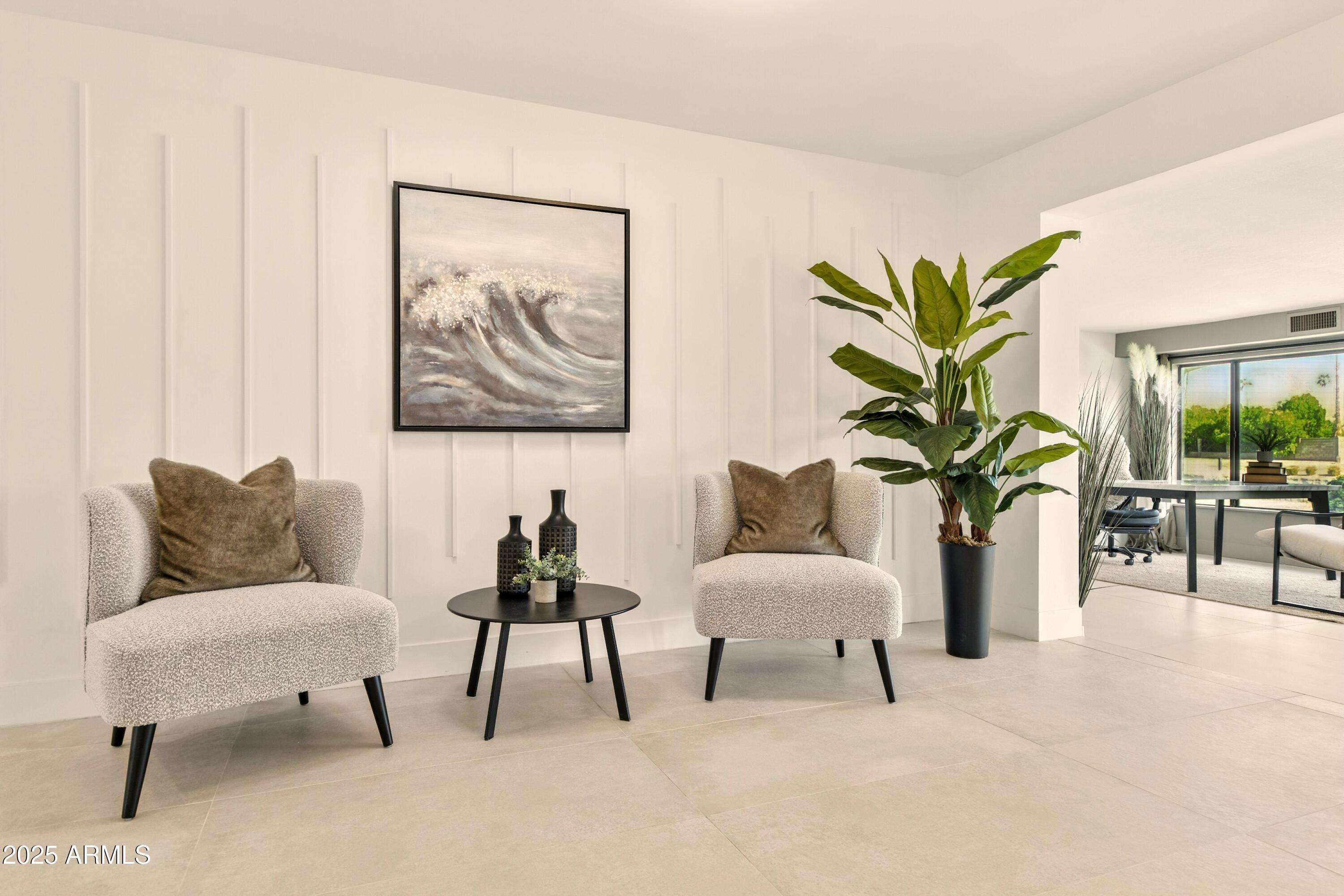 2425 West Impala Circle Mesa, AZ 85202 - Photo 13 of 55 a living room with furniture and a potted plant