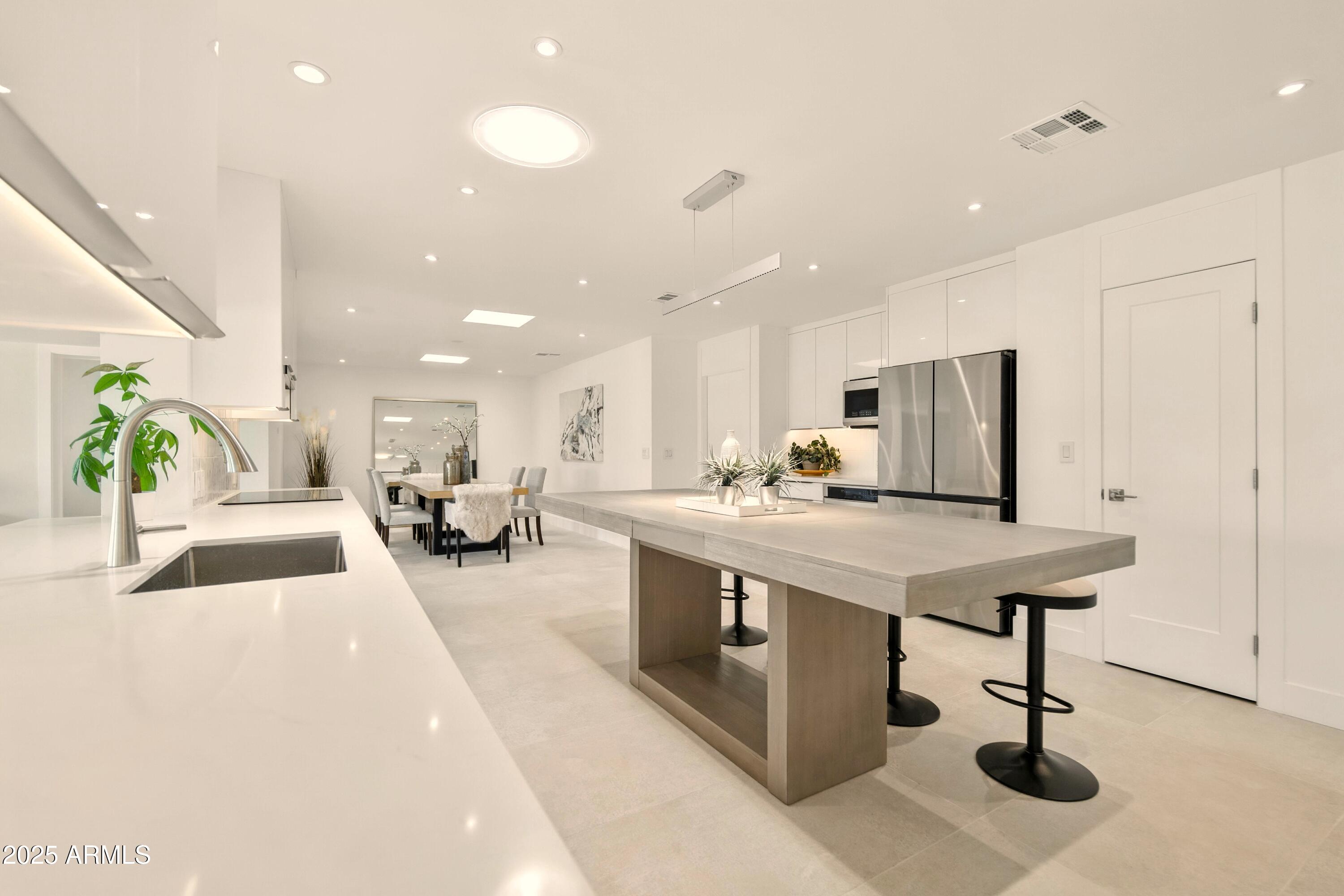 2425 West Impala Circle Mesa, AZ 85202 - Photo 18 of 55 a living room with stainless steel appliances kitchen island furniture and a view of living room