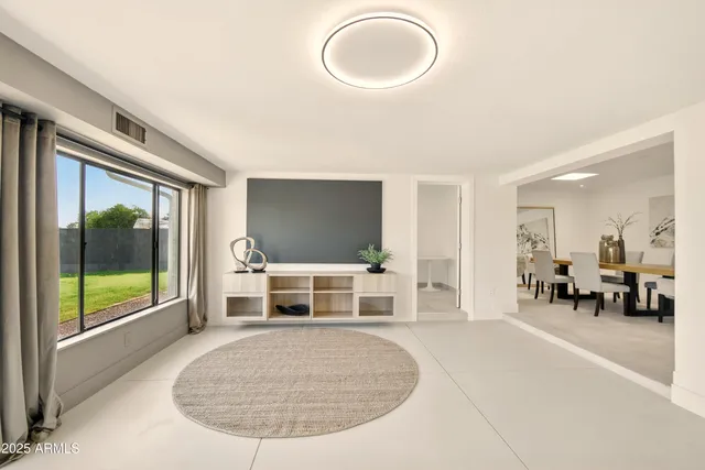 a view of a livingroom with furniture wooden floor and a rug