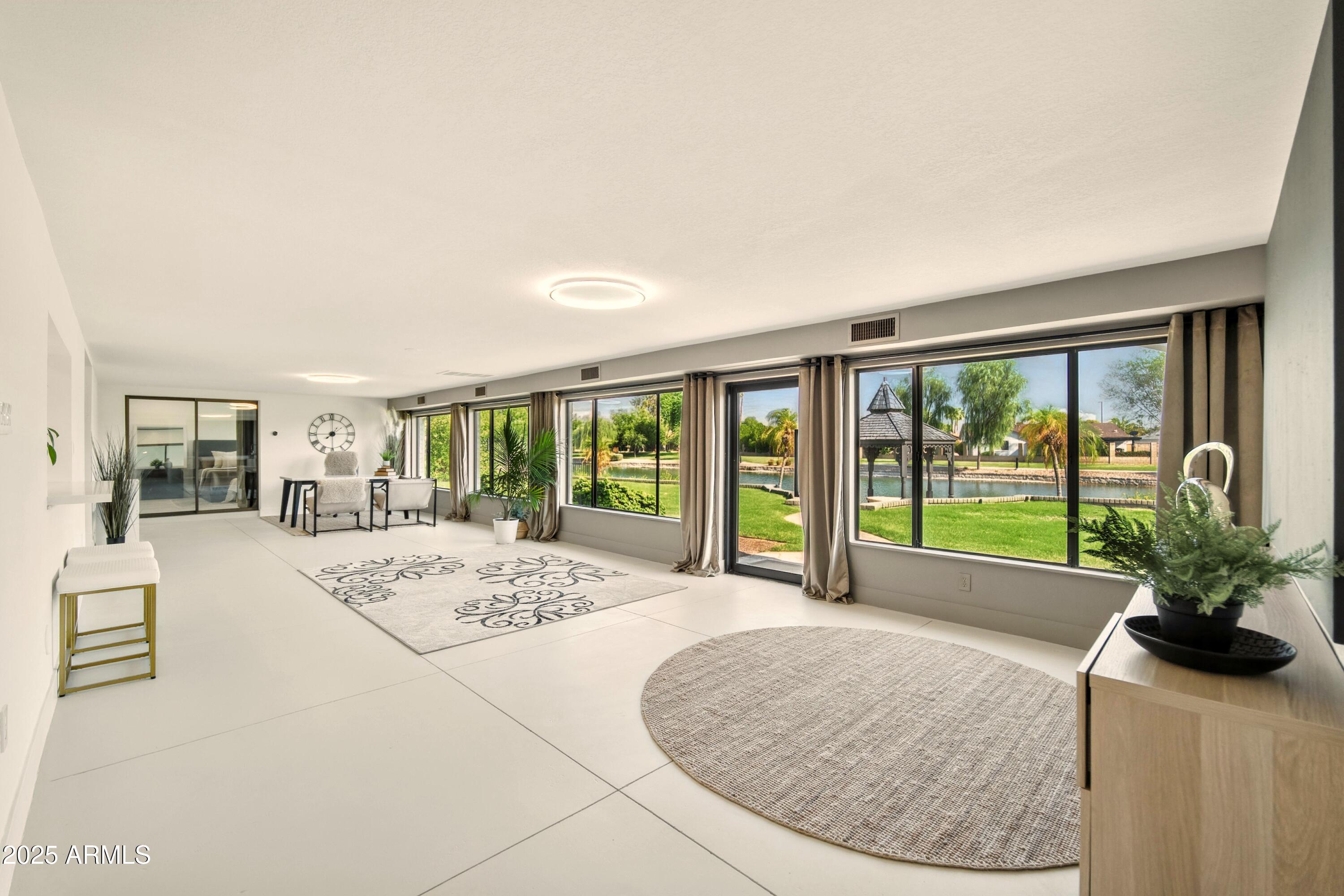2425 West Impala Circle Mesa, AZ 85202 - Photo 28 of 55 a view of a livingroom with furniture wooden floor and a rug