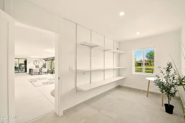 a kitchen with a sink and a white cabinets
