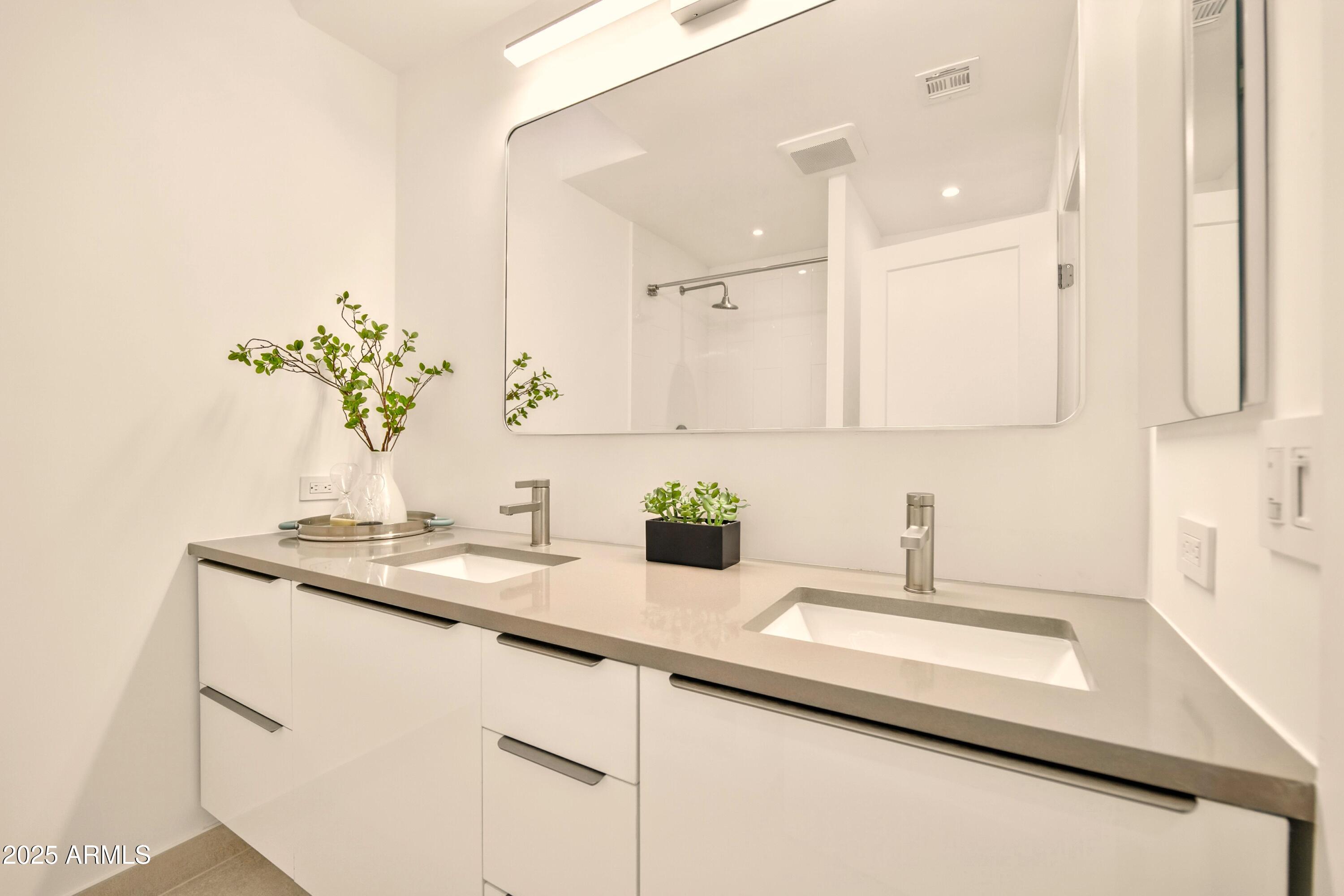 2425 West Impala Circle Mesa, AZ 85202 - Photo 31 of 55 a kitchen with a sink and a white cabinets