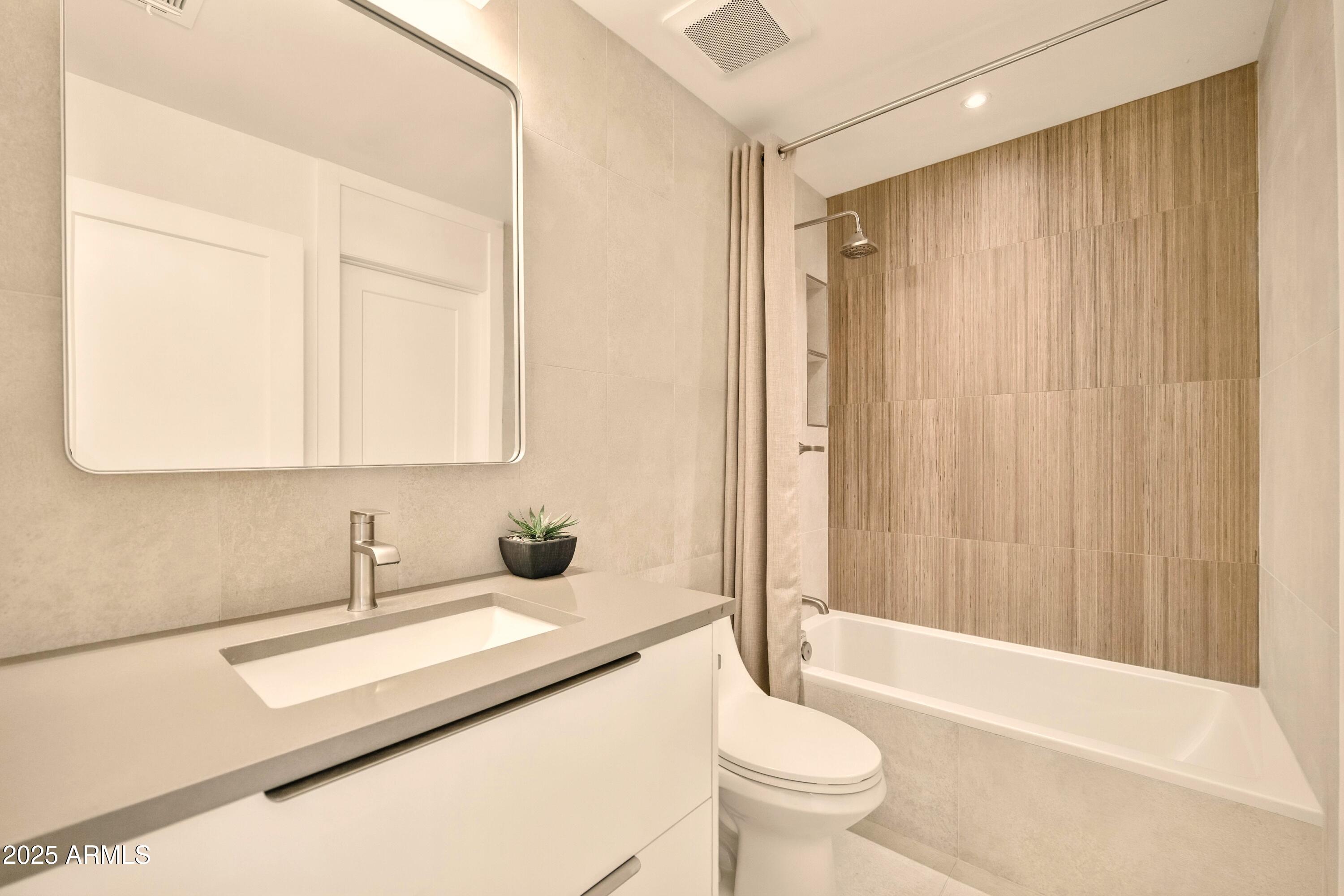 2425 West Impala Circle Mesa, AZ 85202 - Photo 32 of 55 a bathroom with a sink a toilet and shower