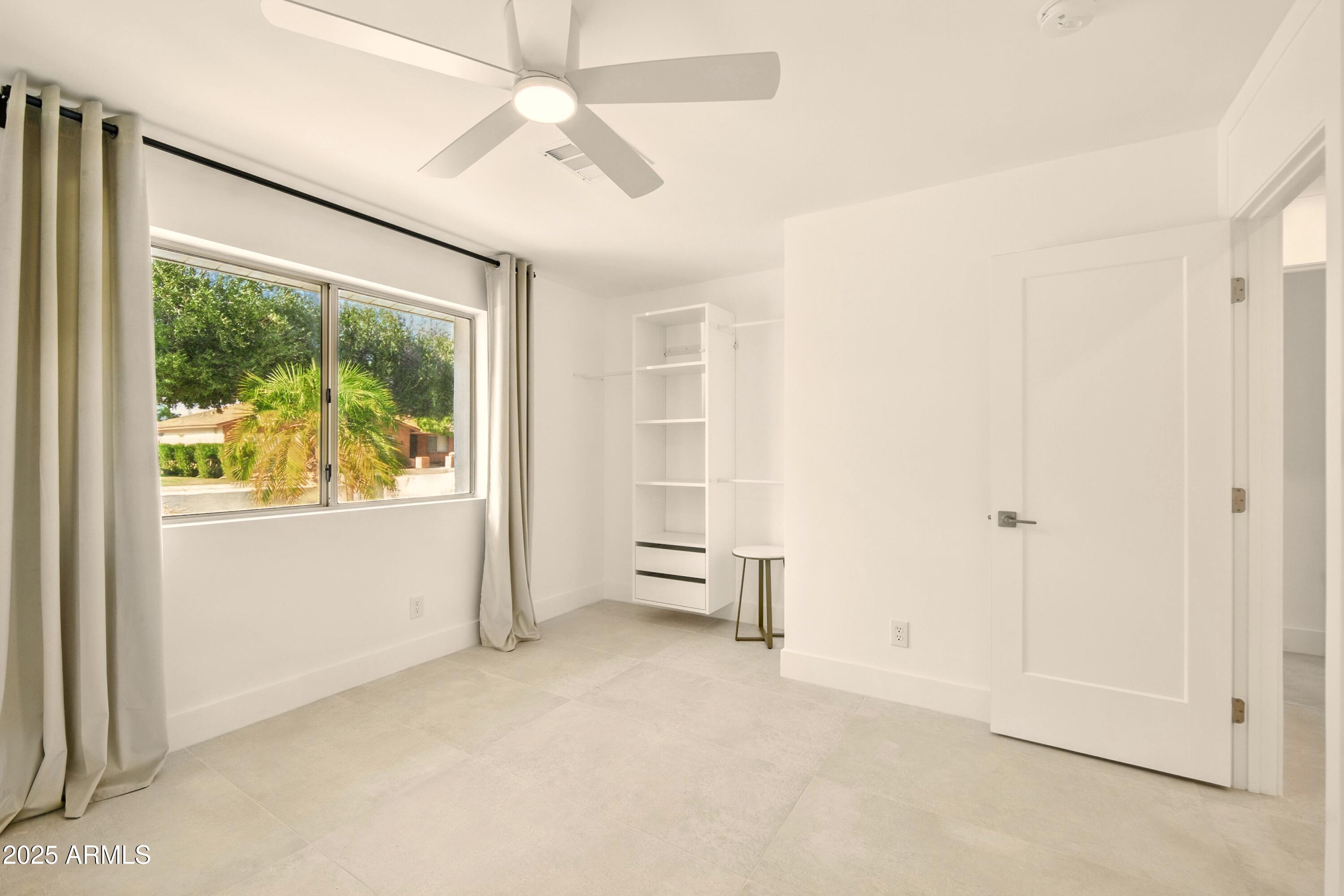 2425 West Impala Circle Mesa, AZ 85202 - Photo 37 of 55 an empty room with windows and closet
