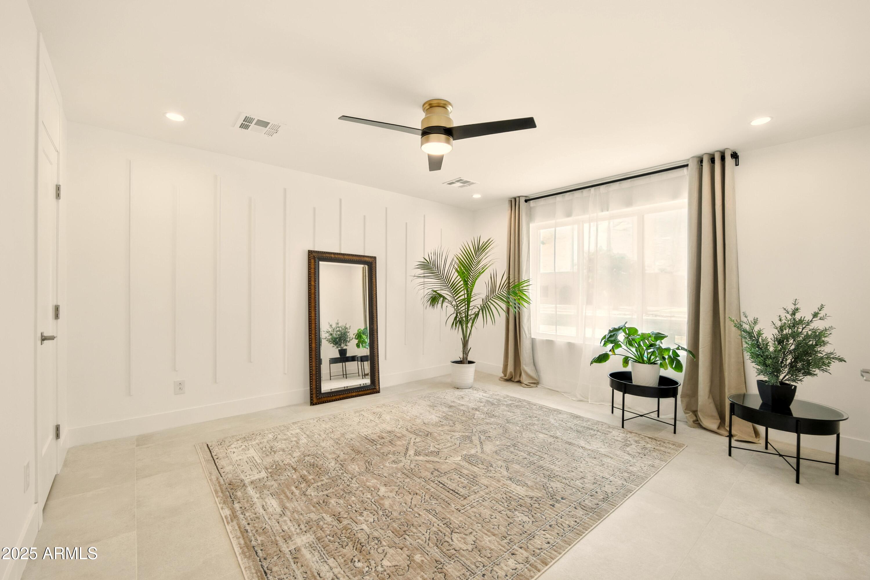 2425 West Impala Circle Mesa, AZ 85202 - Photo 38 of 55 a view of a livingroom with a potted plant and wooden floor