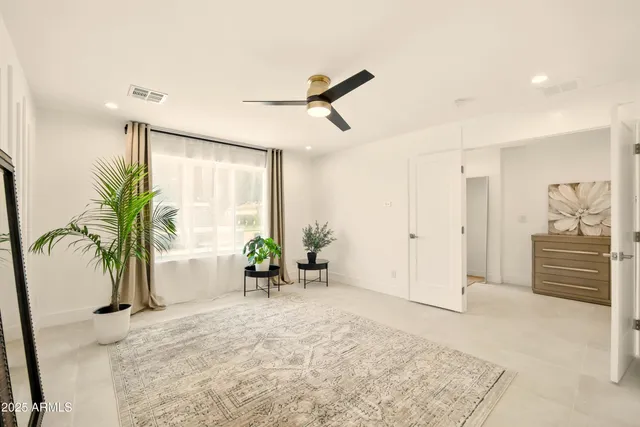 a view of a bedroom with a white walls