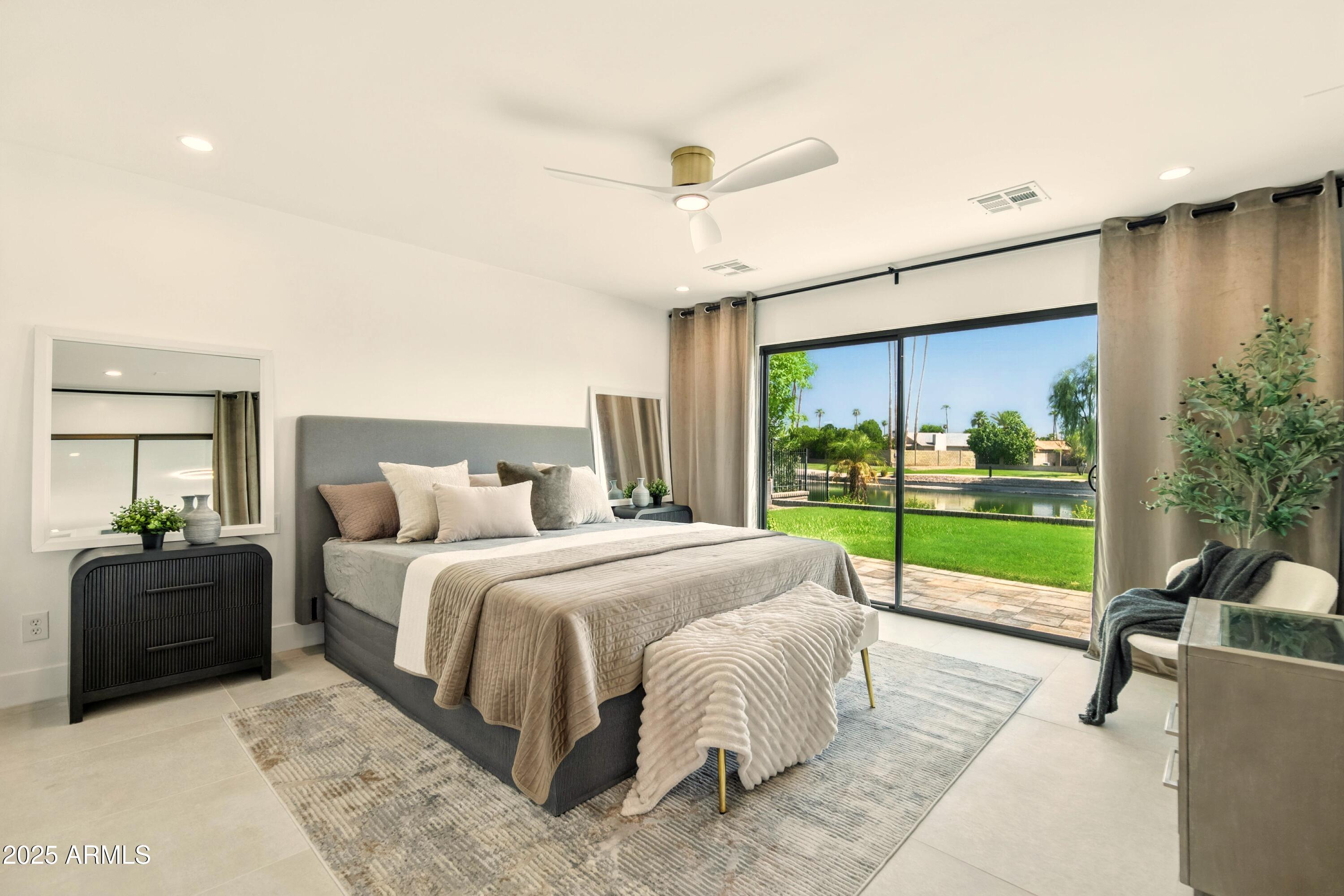 2425 West Impala Circle Mesa, AZ 85202 - Photo 40 of 55 a bed room with a bed and a large window