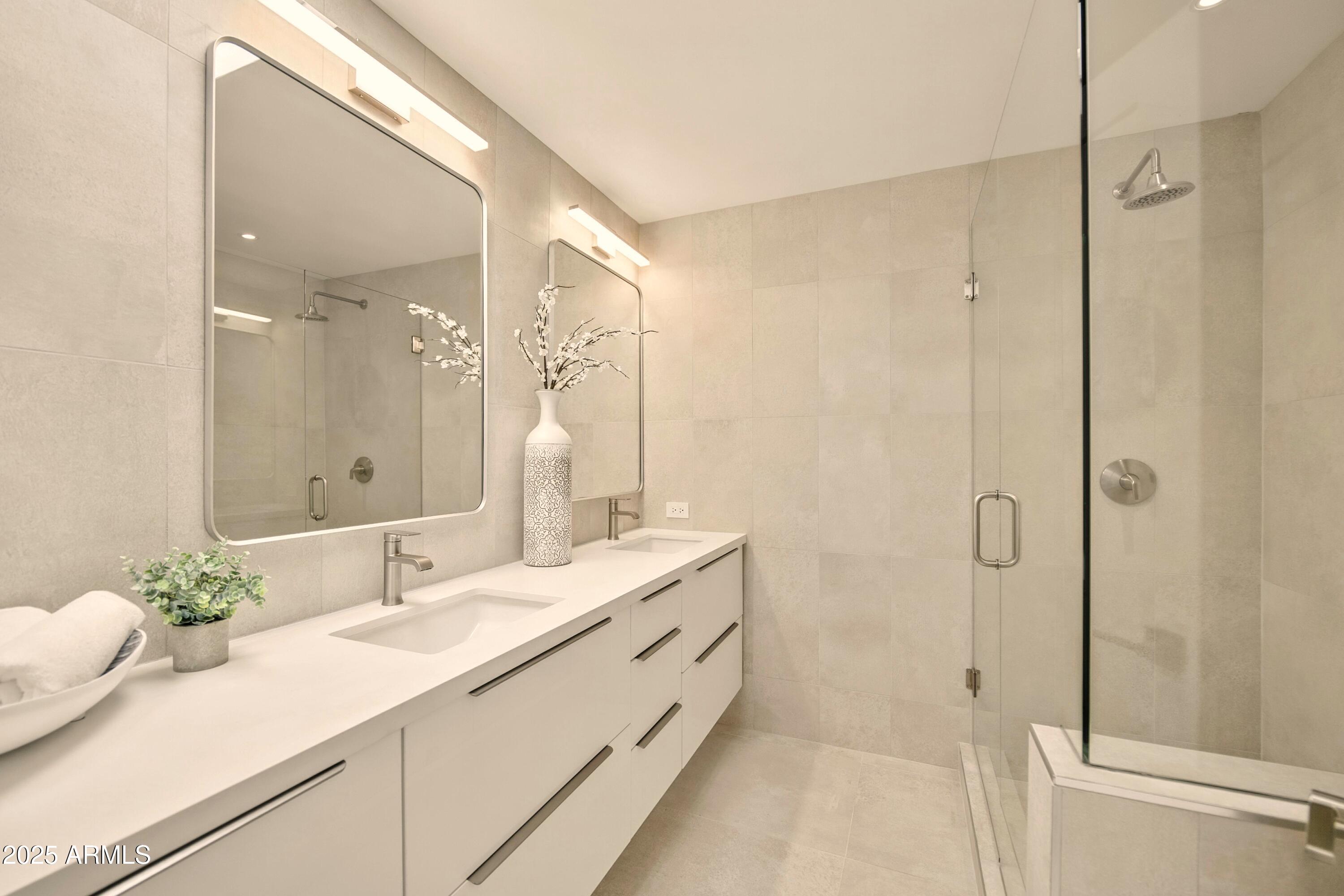 2425 West Impala Circle Mesa, AZ 85202 - Photo 42 of 55 a bathroom with a double vanity sink mirror and shower